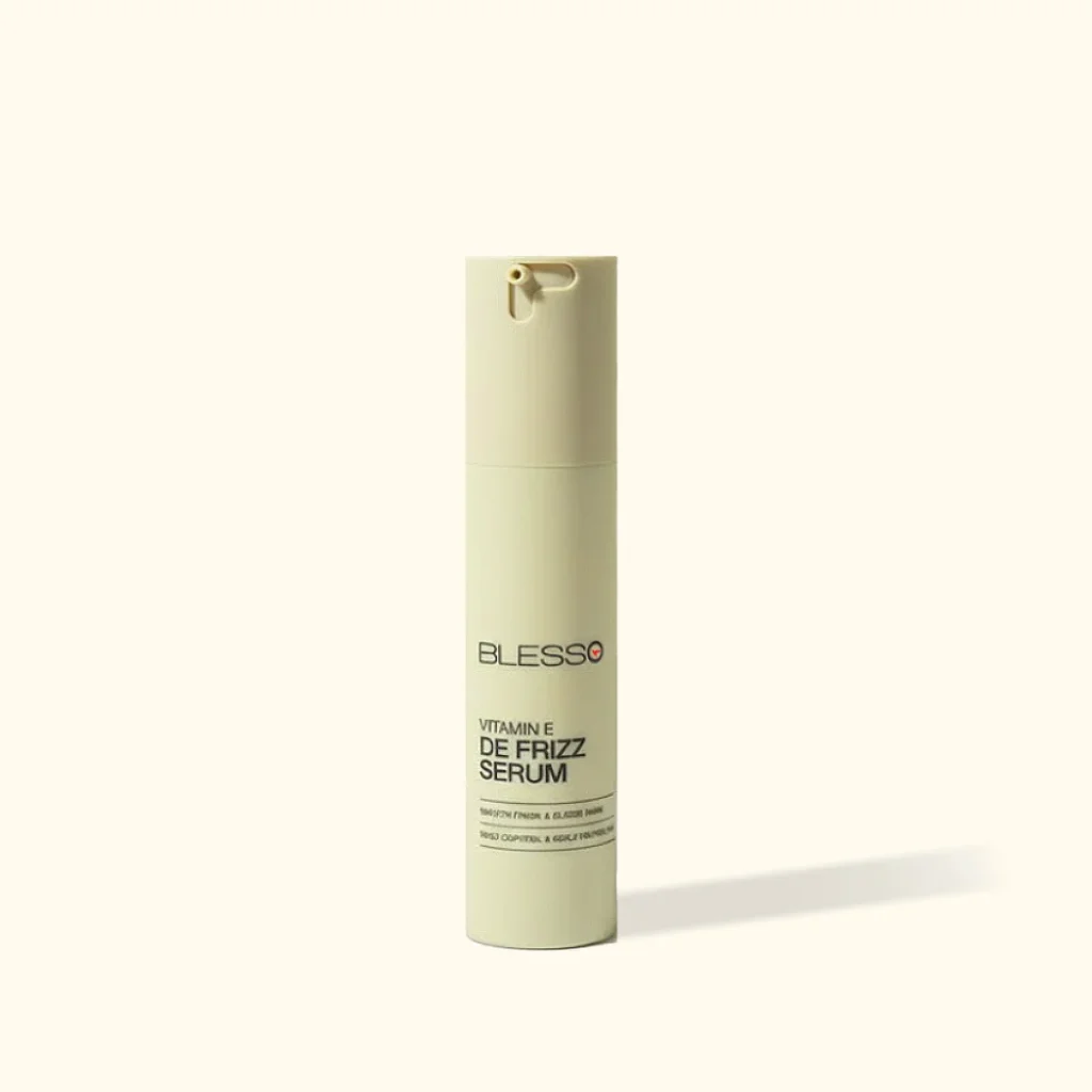 Vitamin E Care: Blesso Vitamin E De-Frizz Hair Serum is designed to provide Vitamin E-focused care for everyday hair styling. De-Frizz Formula: Helps tame the appearance of frizz and flyaways for a smoother-looking hairstyle. Smooth & Manageable Hair: Helps improve hair manageability and provides a softer, more polished feel. Healthy-Looking Shine: Helps enhance the appearance of smooth, naturally shiny-looking hair. Hair Smoothing Care: A convenient option for managing unruly-looking hair as part of your daily routine. Daily Hair Styling: Suitable for regular grooming and styling. Easy Application: Apply a small amount to the hair according to the manufacturer's directions.